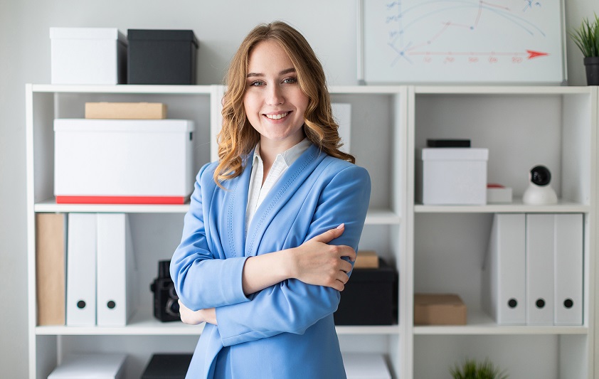 Charming young girl in a blue jacket and white blouse. photo with depth of field